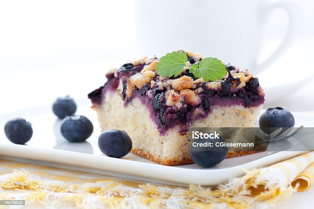 fresh bilberry cake fresh bilberry cake on a plate with mint Baked Stock Photo