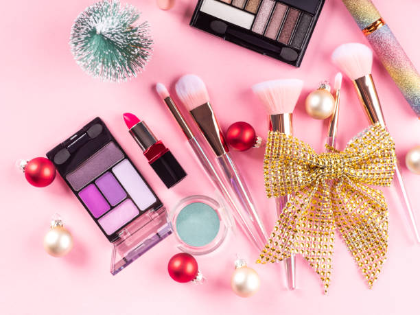 istock Christmas present with make up brushes, products on pink 1357556167