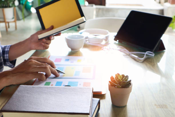 istock businessman hand working use statistics on the graph to study online trading investment profits.concept 1357556283
