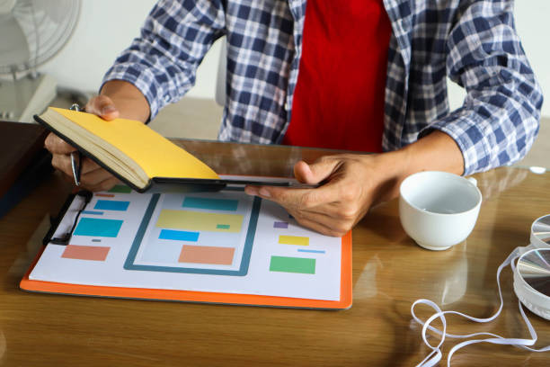 istock businessman hand working use statistics on the graph to study online trading investment profits.concept 1357556292