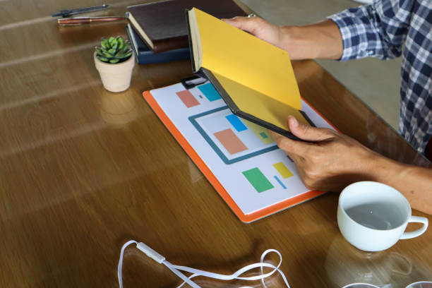 istock businessman hand working use statistics on the graph to study online trading investment profits.concept 1357556293