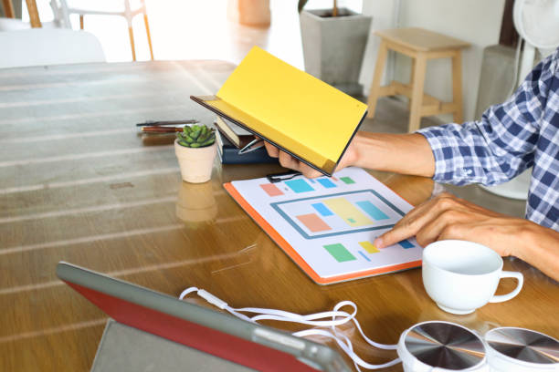 businessman hand working use statistics on the graph to study online trading investment profits.concept