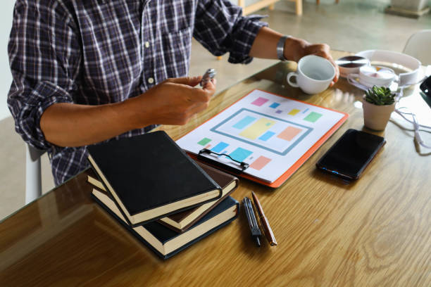 istock businessman hand working use statistics on the graph to study online trading investment profits.concept 1357556300