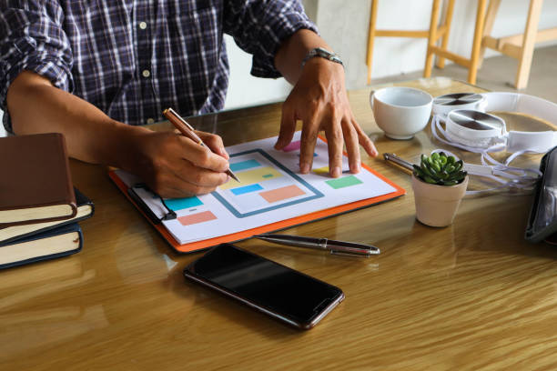 businessman hand working use statistics on the graph to study online trading investment profits.concept