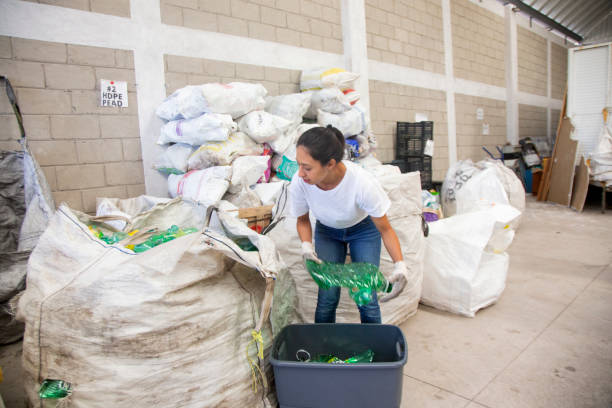 istock Woman working in recycling center 1357557291