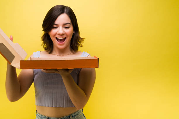 istock Excited woman order pizza 1357558463