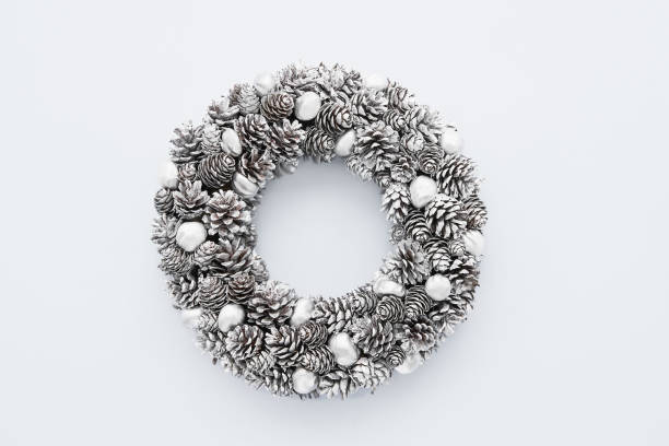 Christmas background. Christmas silver wreath on a light grey background. Copy space, top view.