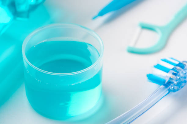 istock Image of using mouthwash to prevent bad breath 1357559042