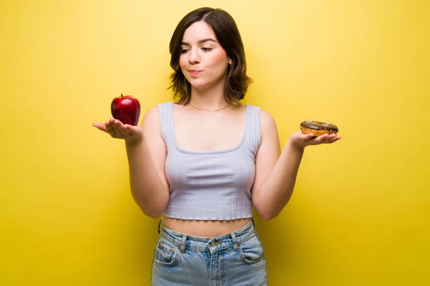 istock Upset woman on a diet with cravings 1357559057