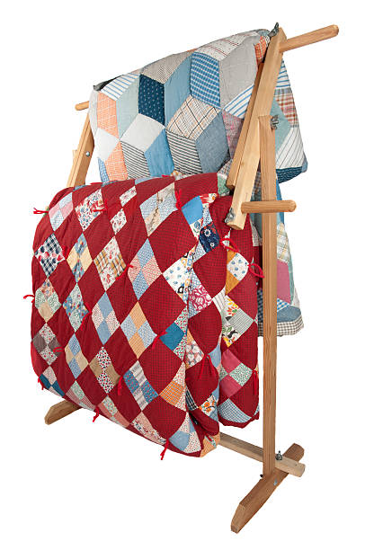 Antique Quilts On Wooden Rack. stock photo