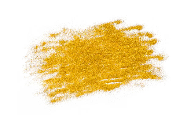 istock Gold sparkles on white. Golden glitter background. 1357568139