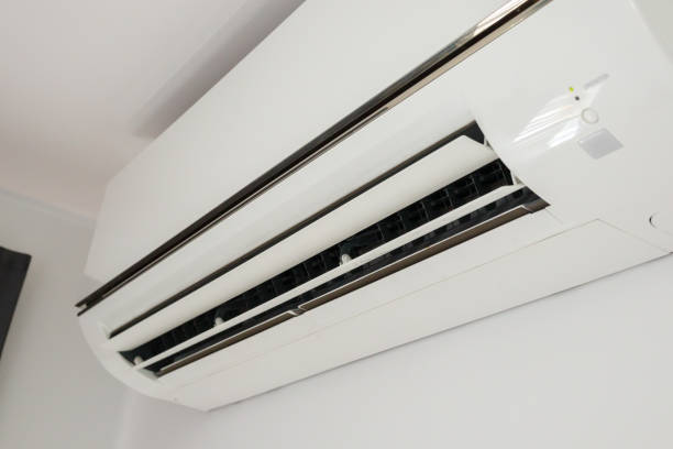 istock Air conditioner on white wall room interior background 1357569480