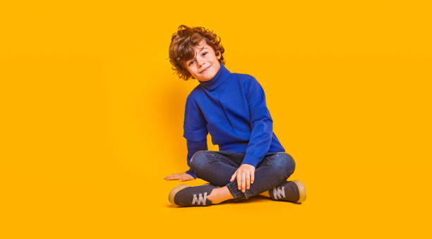 Glad child in stylish clothes