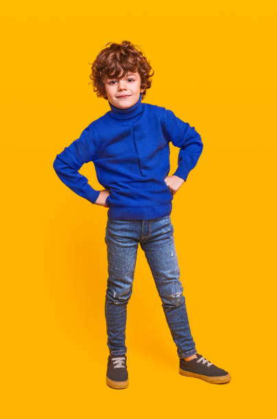 istock Confident stylish boy with hands on waist 1357570183