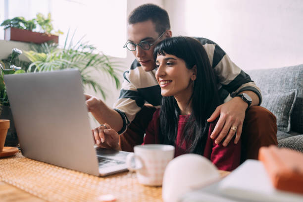 istock A Smart Man Showing Something To His Girlfriend On The Laptop 1357572808