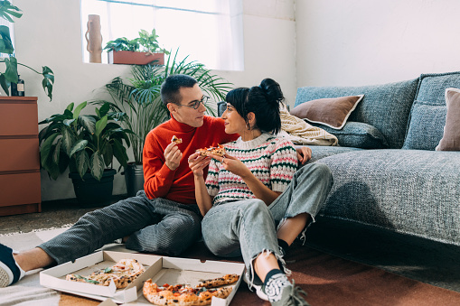 Eating pizza together is the definition of happiness.