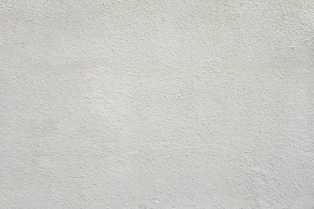 istock White seamless concrete wall texture background, cement wall with a small relief, plaster texture, for designers, white seamless 1357573436