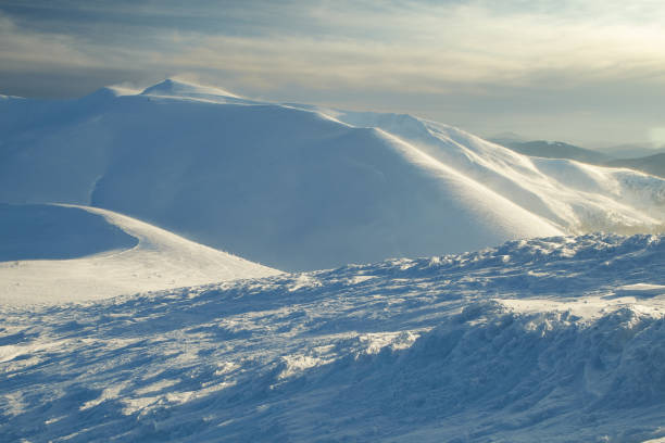 istock Winter mountains snowy panorama in sunset. Background for Christmas design 1357573457