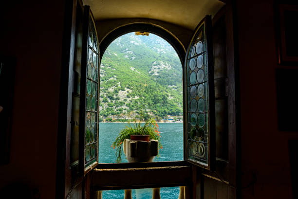 istock Open window with sea and mountain views 1357576572