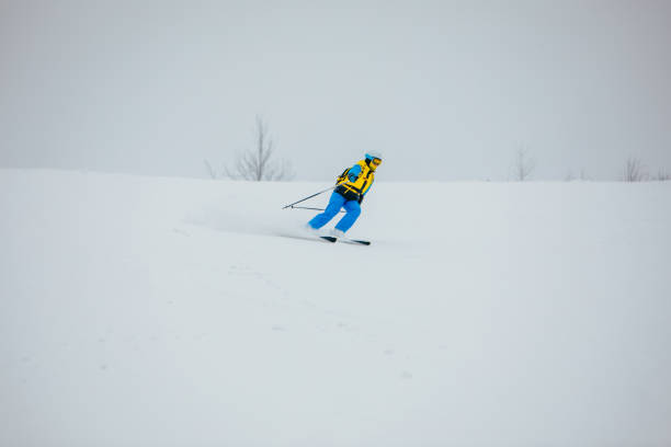 istock woman skier at ski slope 1357577283