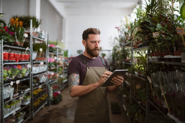 istock Florist Using Digital Tablet In Flower Shop 1357579707