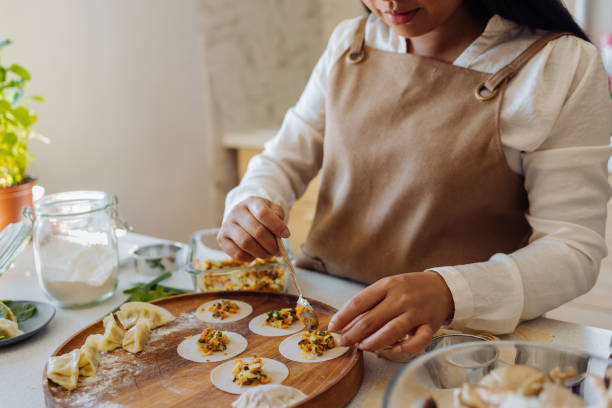 An Anonymous Woman Preparing Healthy Meal in her Kitchen