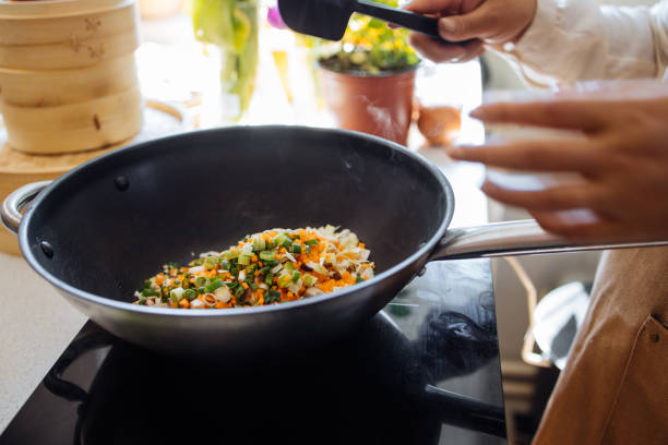 istock An Anonymous Woman Preparing Healthy Meal in her Kitchen 1357580565