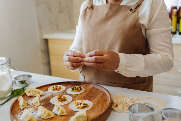istock An Anonymous Woman Preparing Healthy Meal in her Kitchen 1357580613