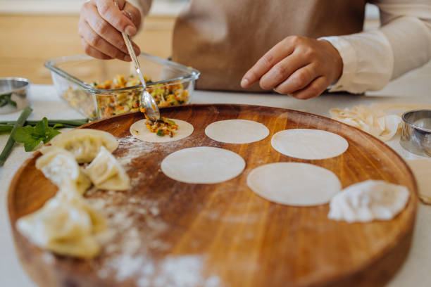 istock An Anonymous Woman Preparing Healthy Meal in her Kitchen 1357580712