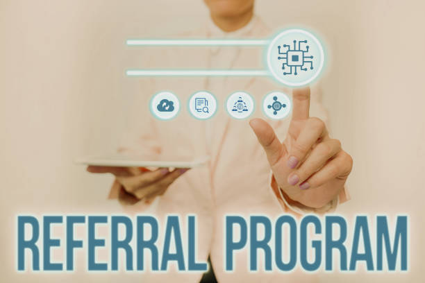 istock Text showing inspiration Referral Program. Business approach employees are rewarded for introducing suitable recruits Lady Holding Tablet Pressing On Virtual Button Showing Futuristic Tech. 1357581086