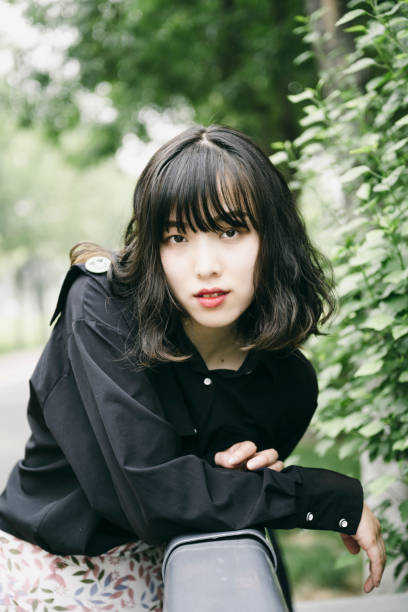 istock Young asian girls in the sun 1357581983