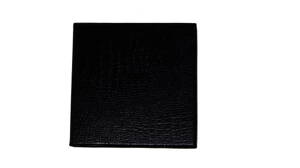 small black square with snake or crocodile skin texture
artificial for gift box on white background stock photo