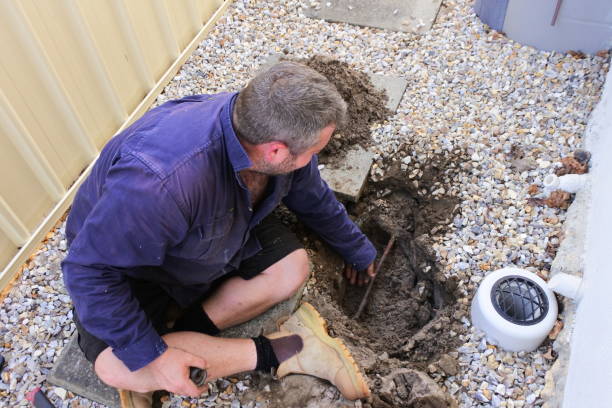 istock Plumber fixing an underground water pipe leaking 1357589545
