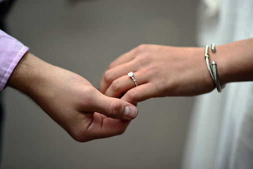 holding hand with diamond ring, wedding proposal