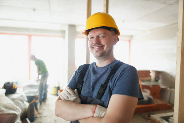 istock A foreman in a helmet is standing indoors 1357595913