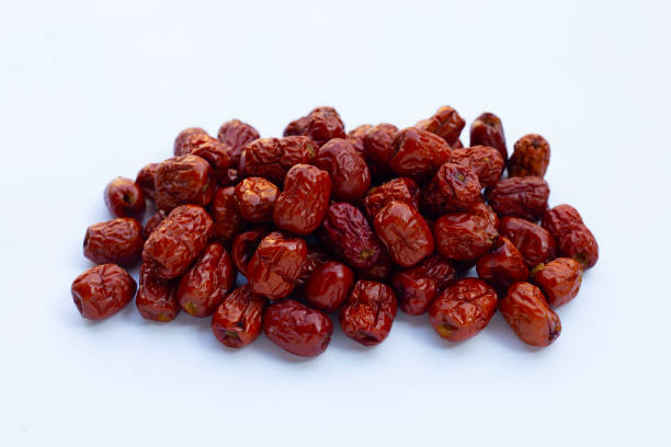 istock Dried Chinese jujubes isolated on white background. 1357596118