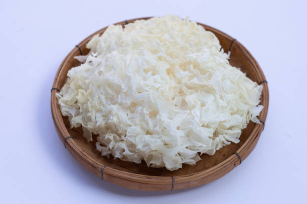 istock Tremella Mushroom in bamboo basket on white background. 1357596185