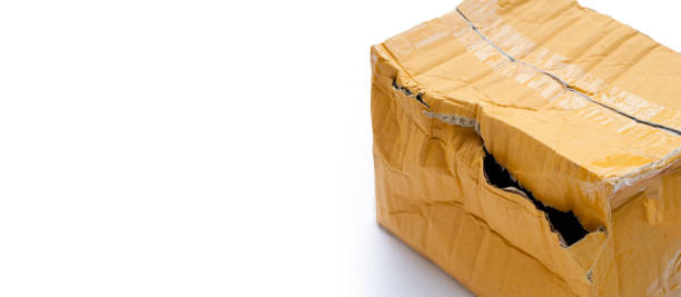 istock Damaged cardboard box with hole 1357596359