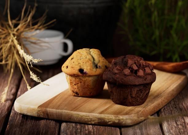 istock Muffins on wood cutting board 1357597127