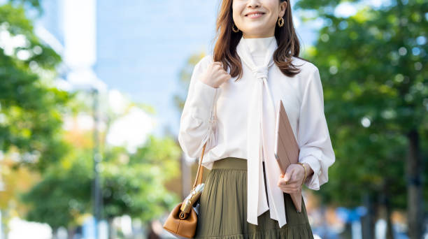 istock Female commuting in office casual style 1357597368
