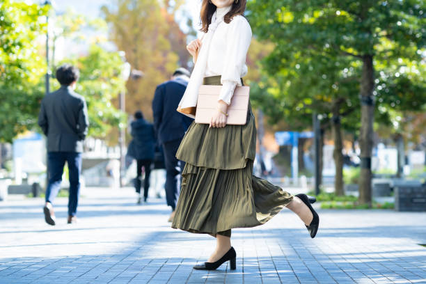 istock Female commuting in office casual style 1357597415