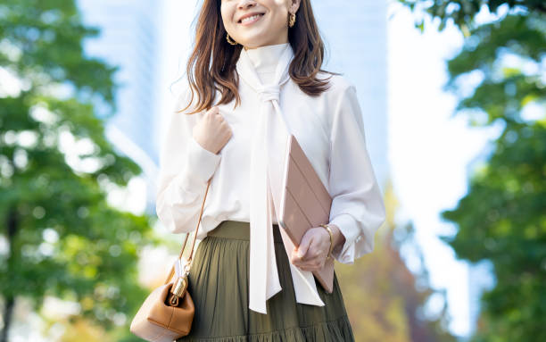 istock Female commuting in office casual style 1357597433