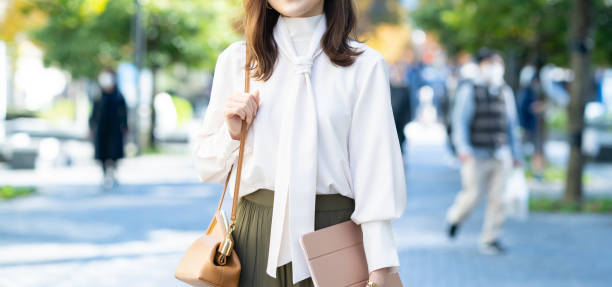 istock Female commuting in office casual style 1357597481