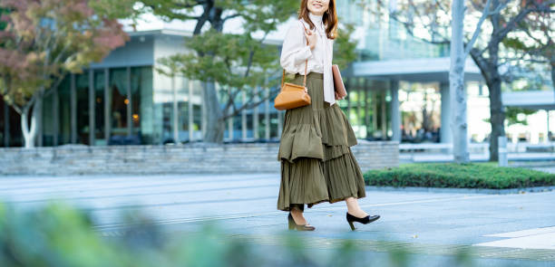 istock Female commuting in office casual style 1357597507