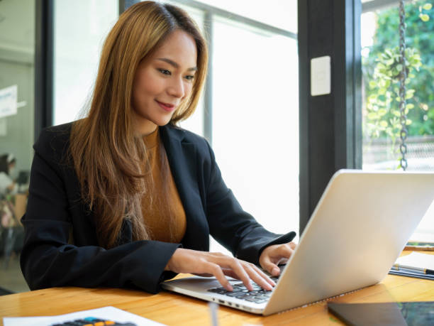 istock Business women working on laptop computer. 1357598266