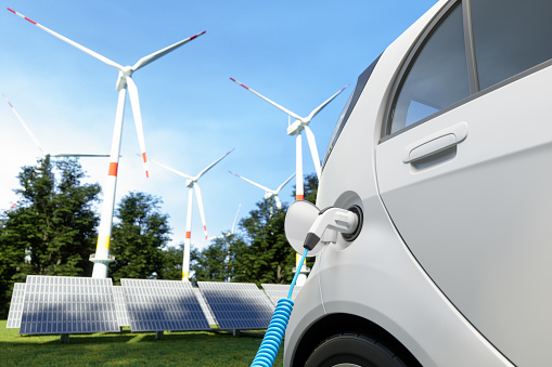 Electric Car Charging For Eco-Friendly Transport With Solar Panels And Wind Turbines Background.