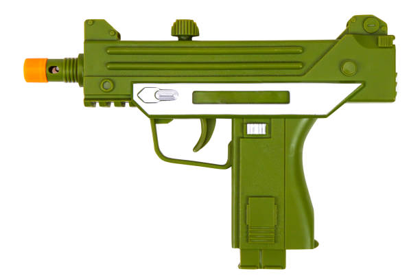 istock Green toy submachine gun on a white background, isolated image 1357599899