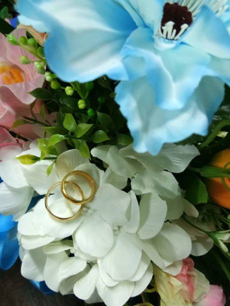 istock Two gold rings, wedding rings. 1357599982
