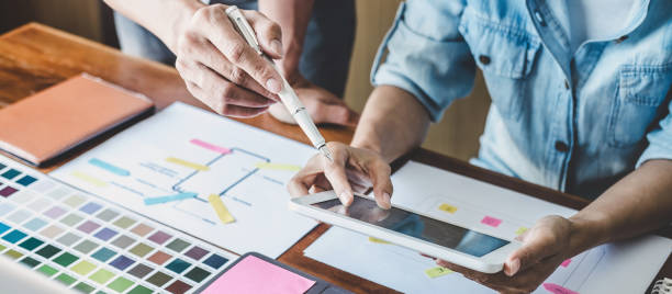istock Team of Creative Web/Graphic Designer planning, drawing website ux app for mobile phone application and development template layout, process to developing prototype wireframe, User experience concept 1357606453