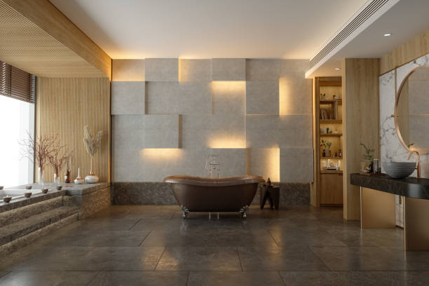 элегантный современный интерьер ванной комнаты с мраморным полом, коричневой ванной и раковиной на столешнице - tiled floor ceramic floor model home стоковые фото и изображения